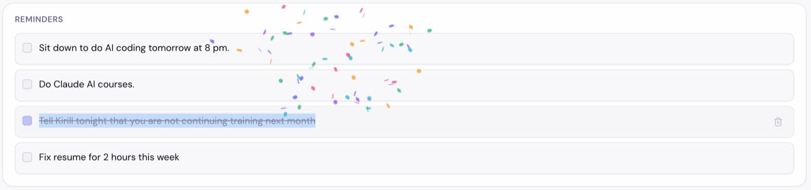 The Reminders widget mid-celebration: confetti falling as a reminder is checked off.